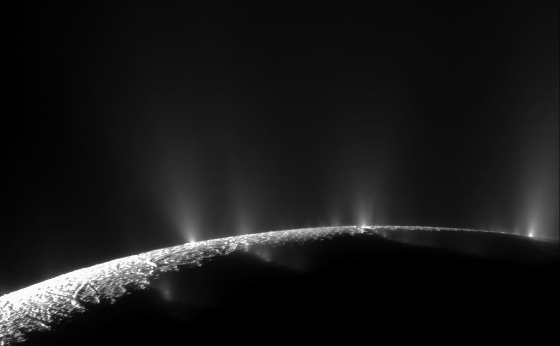 NASA Cassini image of water ice and vapor plumes erupting from the south pole of Saturn's moon Enceladus.