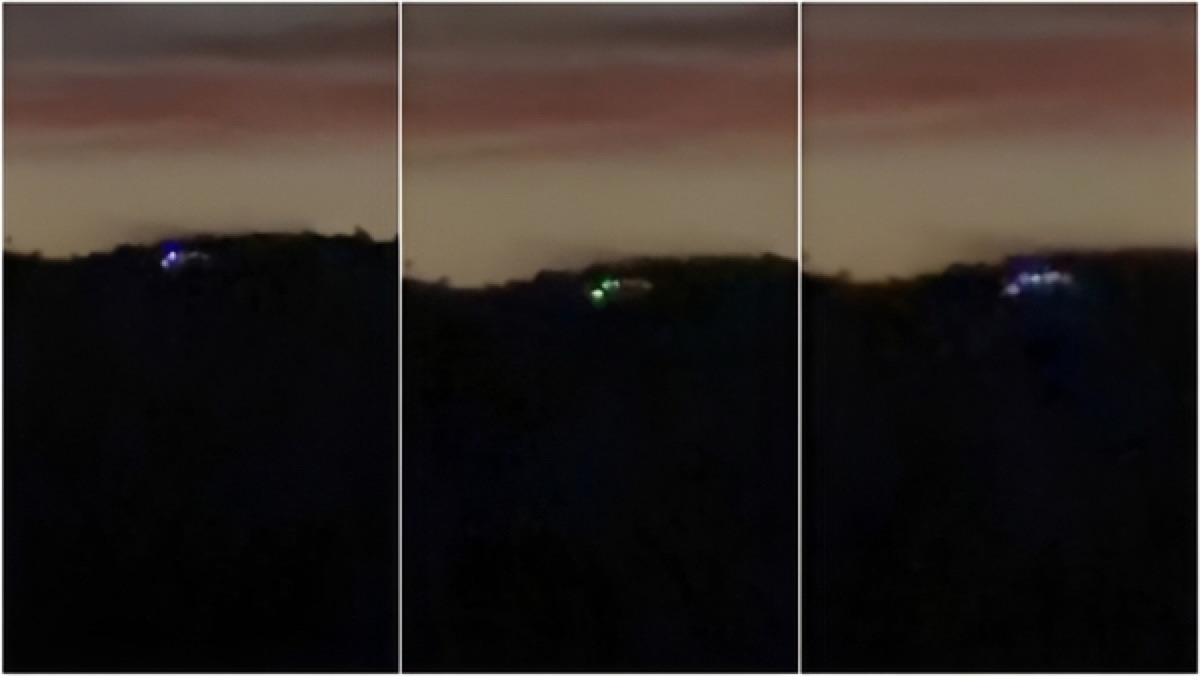 Source-derived frame composite from the viral Paraná UFO clip showing distant colored lights near a dark ridge line in Campo Largo, Brazil.