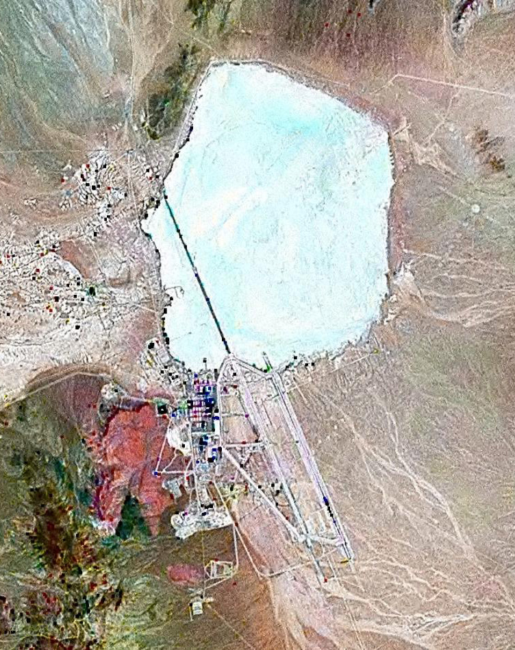False-color satellite image of Groom Lake in Nevada, showing the dry lake bed and the Area 51 flight-test facility along its southern edge.