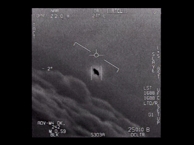 Single frame from the official U.S. Navy GIMBAL video, captured on 21 January 2015 by an F/A-18F Super Hornet ATFLIR pod off the U.S. East Coast near Florida. The frame shows the ATFLIR crosshair centered on the now-iconic rotating object with its visible halo, against the Atlantic Ocean below. Telemetry overlay shows 