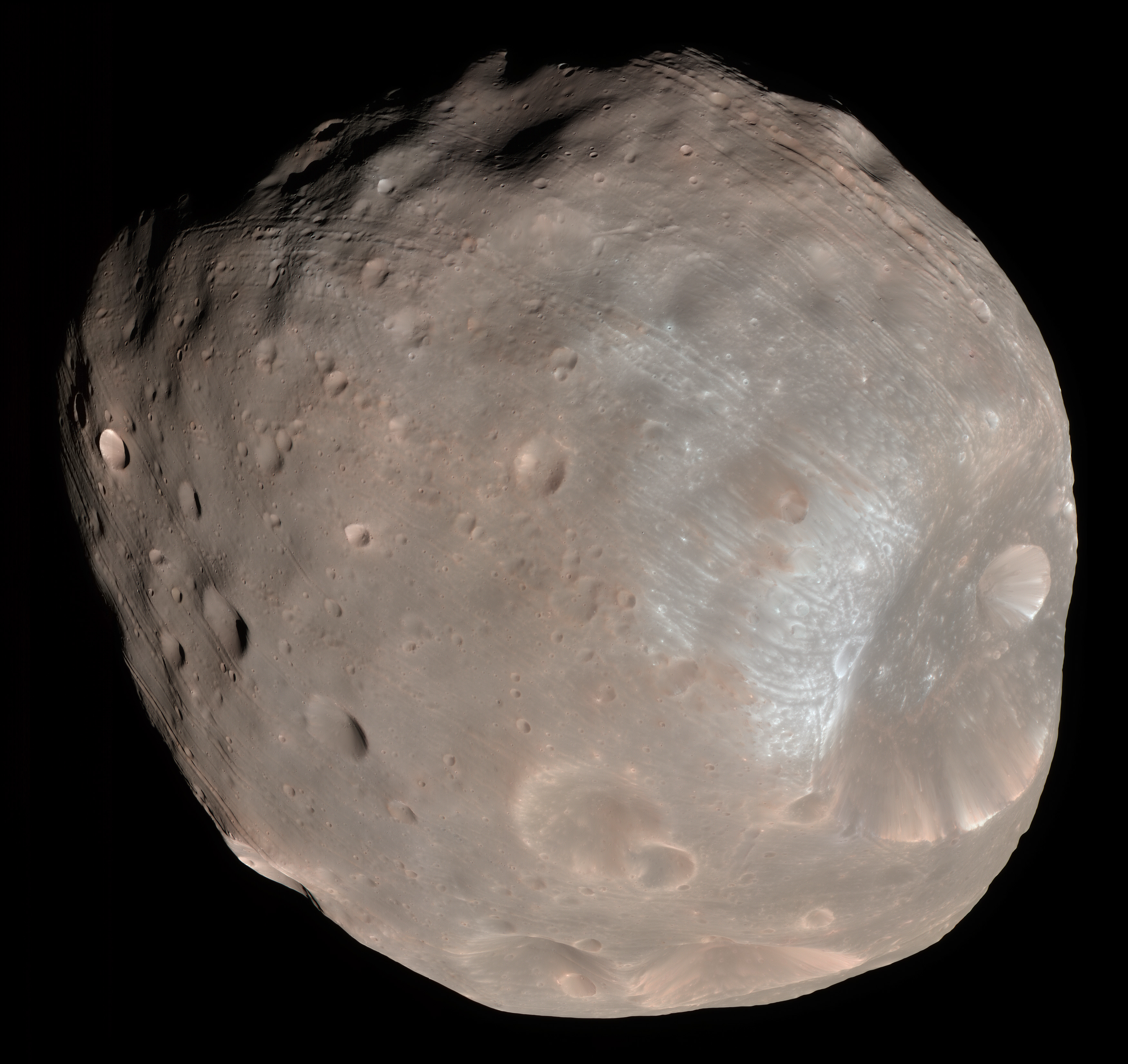 Color image of Phobos, the larger of Mars's two moons, taken by NASA's Mars Reconnaissance Orbiter HiRISE camera on 23 March 2008 from a distance of about 6,800 kilometers. The image shows Phobos's heavily cratered surface with the large Stickney crater visible at lower right. Public domain. NASA / JPL-Caltech / University of Arizona. Used here as a stand-in for the Phobos 2 mission: the Soviet probe was the first to image Phobos at close range, returning 37 high-resolution frames before losing contact on 27 March 1989. The image Popovich showed at the 6 December 1991 San Francisco press conference was, per the article, the last frame of that earlier series.
