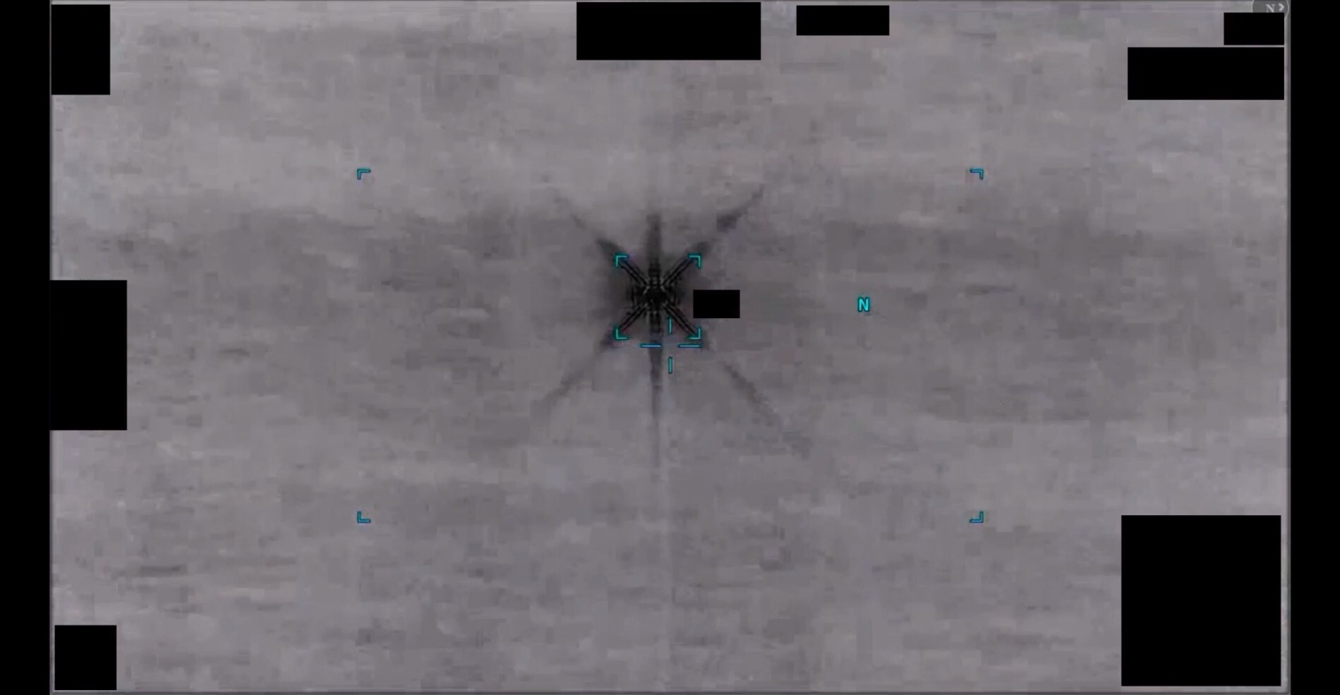 Official Department of War still from DOW-UAP-PR104, showing an infrared area of contrast described as resembling a six-pointed star.