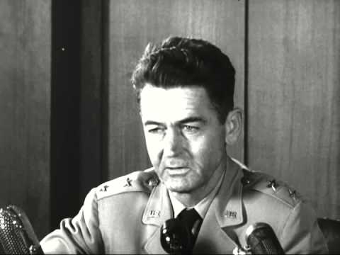 Still from the July 31, 1952 National Archives film featuring Air Force intelligence chief John A. Samford and UFO writer Donald Keyhoe.