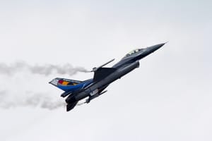 Belgian Air Force F-16 in flight against a pale overcast sky, photographed in 2014. The aircraft is illustrative of the force that scrambled two F-16s during the March 1990 incident; it is not an image from the event.