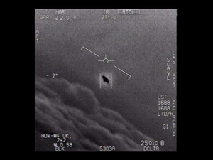 Single frame from the official U.S. Navy GIMBAL video, captured on 21 January 2015 by an F/A-18F Super Hornet ATFLIR pod off the U.S. East Coast near Florida. The frame shows the ATFLIR crosshair centered on the now-iconic rotating object with its visible halo, against the Atlantic Ocean below. Telemetry overlay shows "1688C" and "25010 B DCLTR" markings from the Navy targeting system. This is the same 34-second video the U.S. Department of Defense officially declassified and released on 27 April 2020, and remains one of the three UAP clips the U.S. government has authenticated as authentic Navy footage. Public domain under 17 U.S.C. § 105. U.S. Navy / U.S. Department of Defense.
