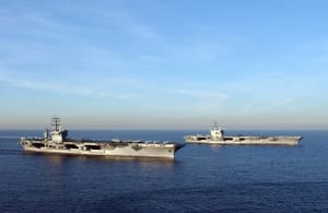 USS Nimitz and USS Ronald Reagan navigate during training exercises off Southern California on November 16, 2004.