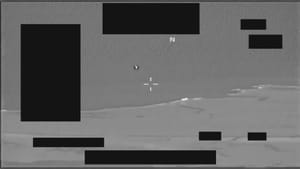 Public DVIDS infrared frame from UAP report DOW-UAP-PR112, with a small bright contrast area above a cloud layer and several redacted display fields.